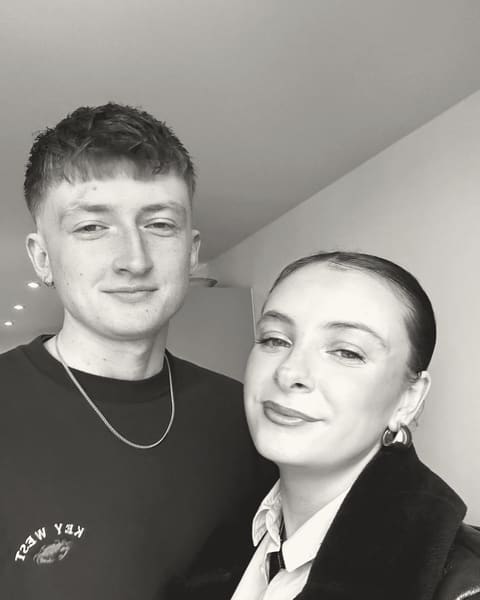 Tallulah and Thomas smiling, dressed up