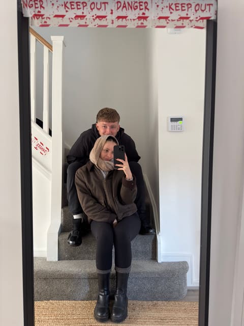 A mirror selfie of Tallulah and Thomas on the stairs