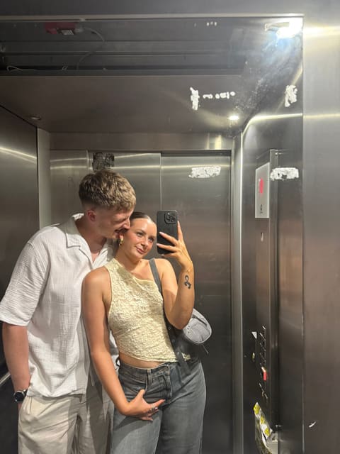 A mirror selfie of Tallulah and Thomas in a lift