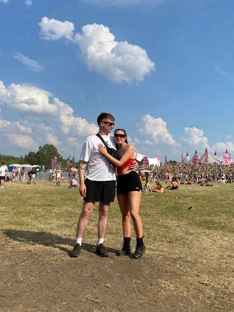 Tallulah and Thomas arm in arm at a festival