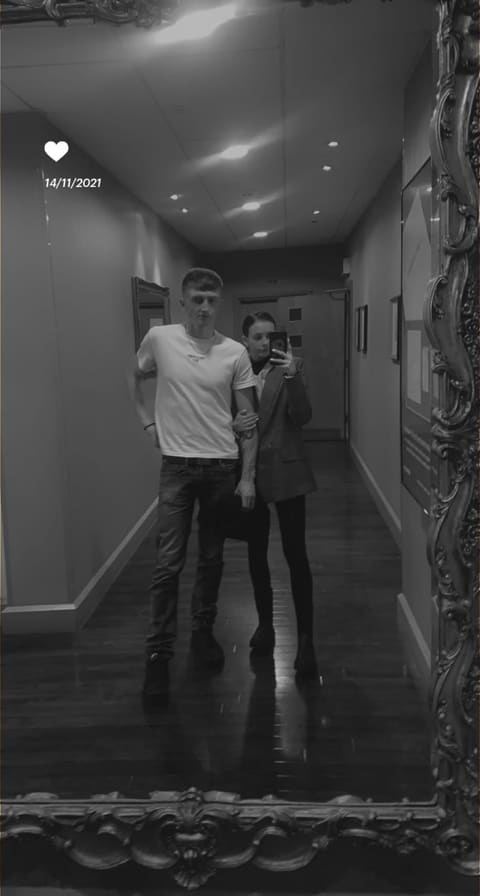 Tallulah and Thomas in a hallway